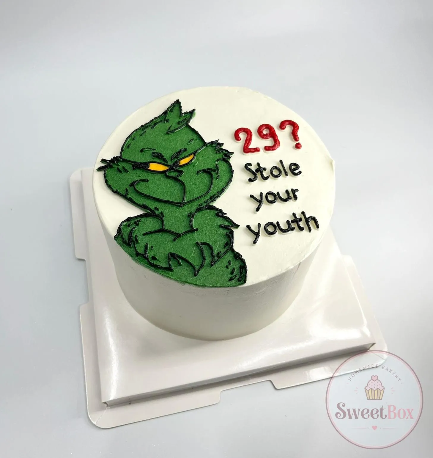 Funny Grinch bento cake with the caption 29? Stole your youth